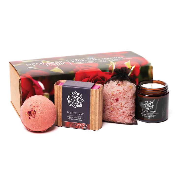 Spa gift set with scarlet rose candle jar, pink bath bomb, bath soak pouch, and soap bar
