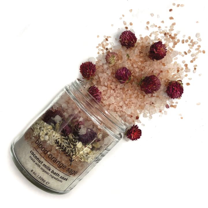 Coconut milk bath soak jar with pink crystals and dried flowers