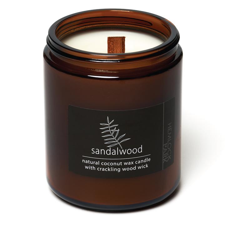 Organic coconut wax candle in amber jar, sandalwood label, wood wick