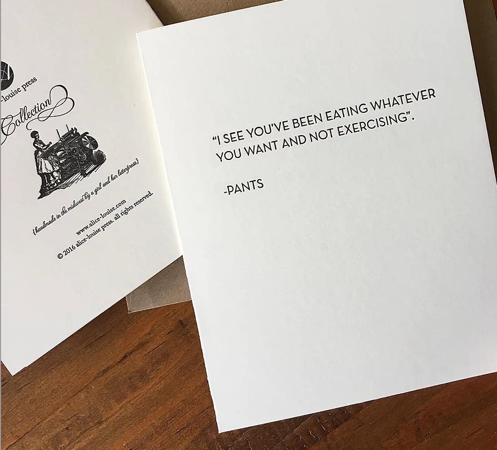 White card with black quote mentioning pants