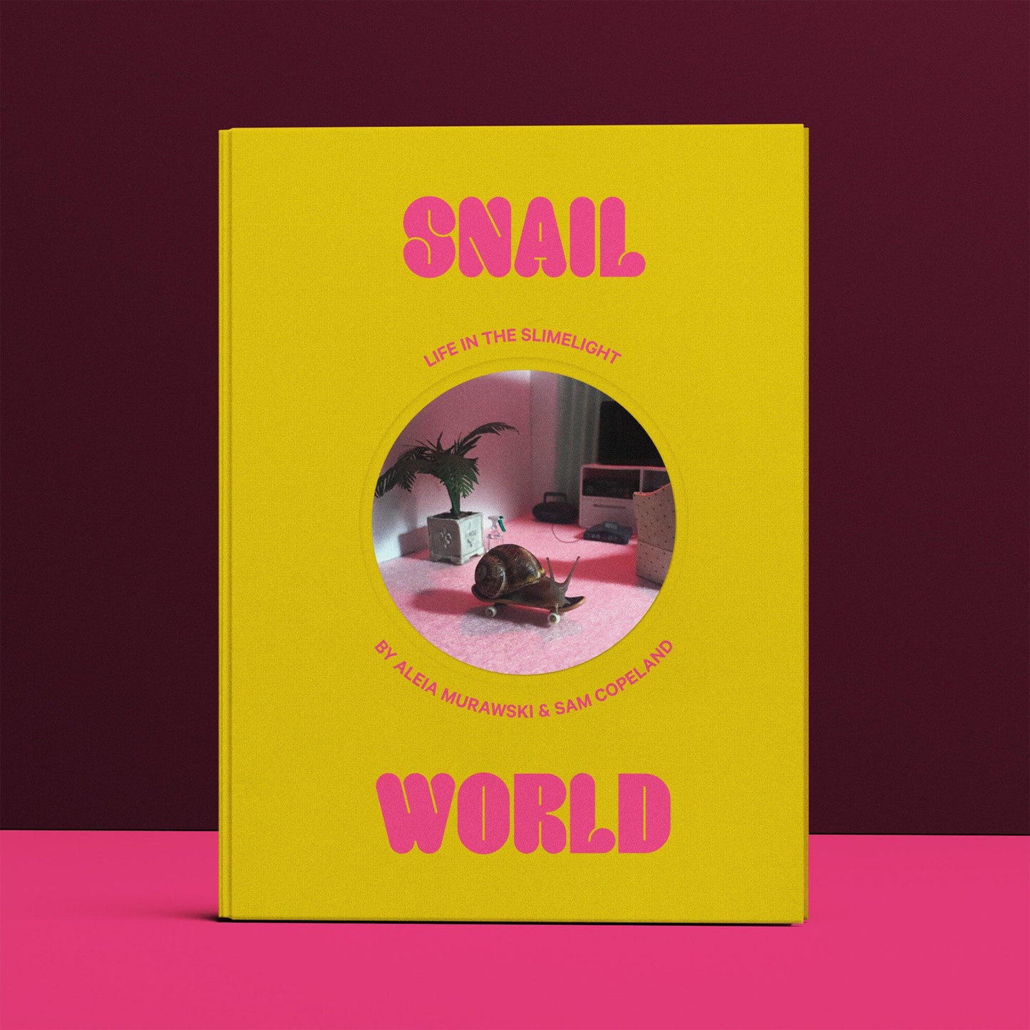 Yellow paperback book cover with pink "SNAIL WORLD" title and round window cutout