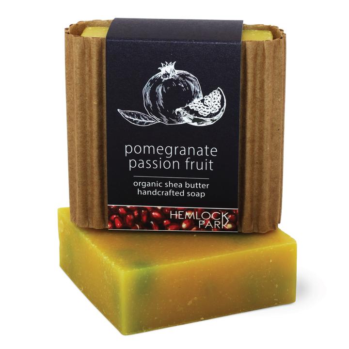 Organic shea butter soap, pomegranate passion fruit, yellow-green bar with red specks.