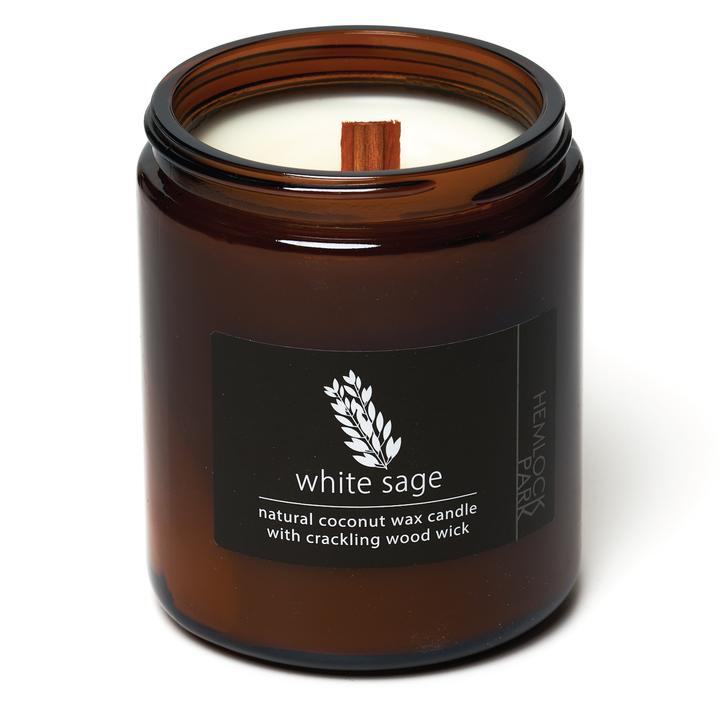 Organic coconut wax candle in amber jar, white sage label, wood wick