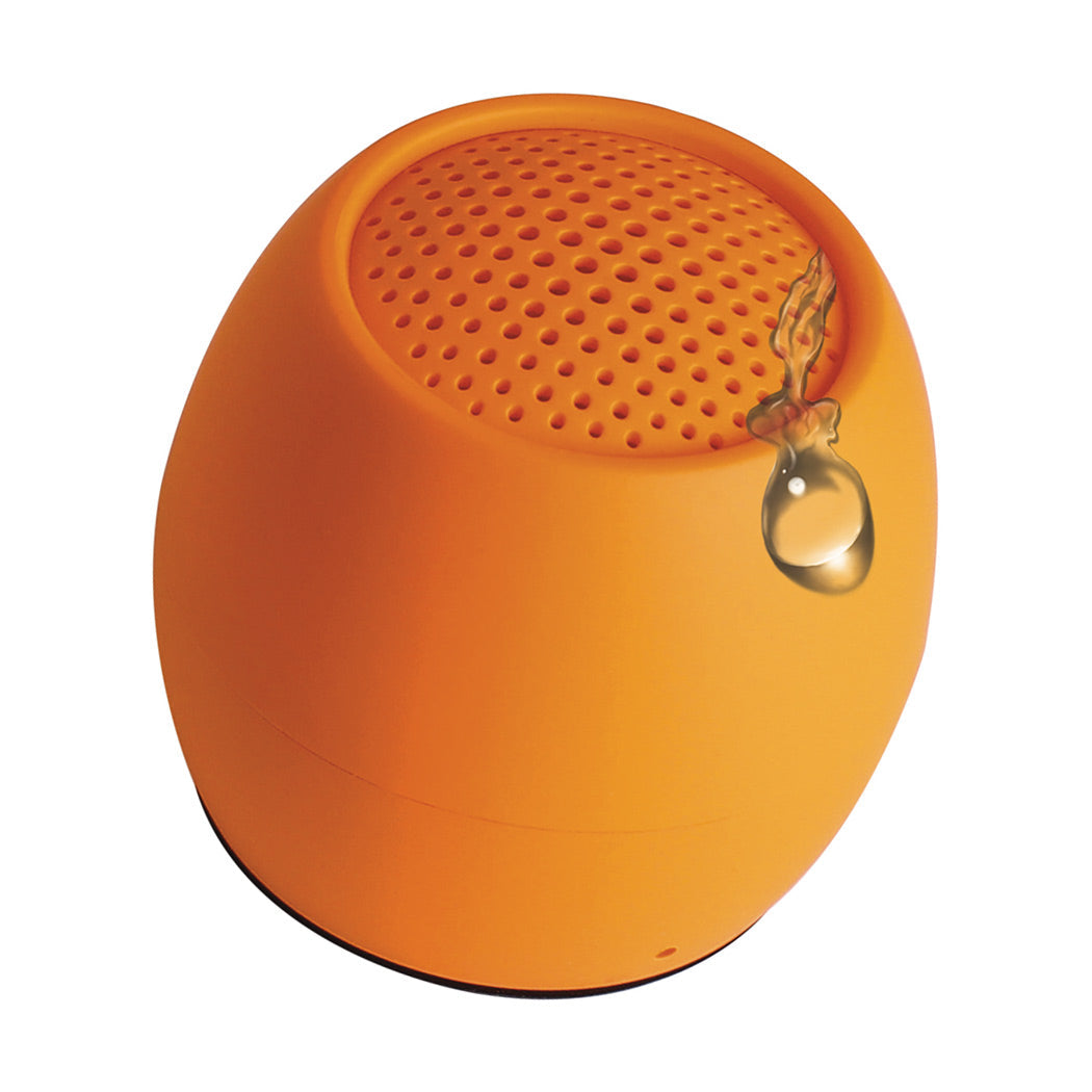 Orange mini wireless speaker with top perforated grille and hanging loop