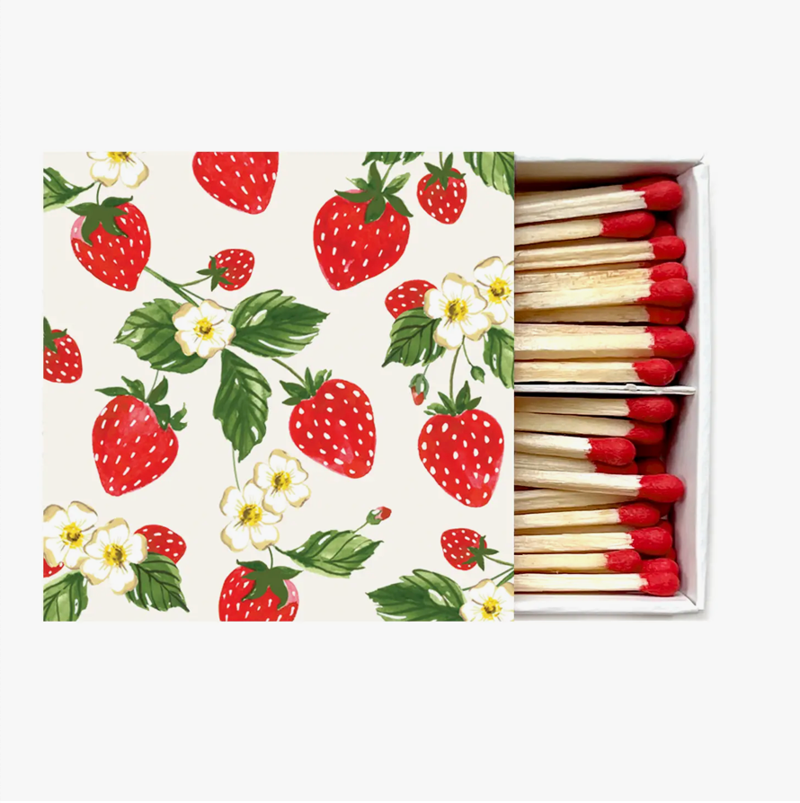 Strawberry-pattern matchbox with exposed wooden matches and red tips