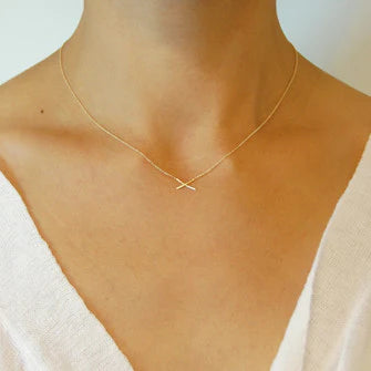 14K gold mini X necklace with small X pendant at center