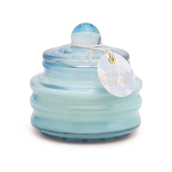 Beam candle in pale blue glossy glass jar with round lid and hanging tag