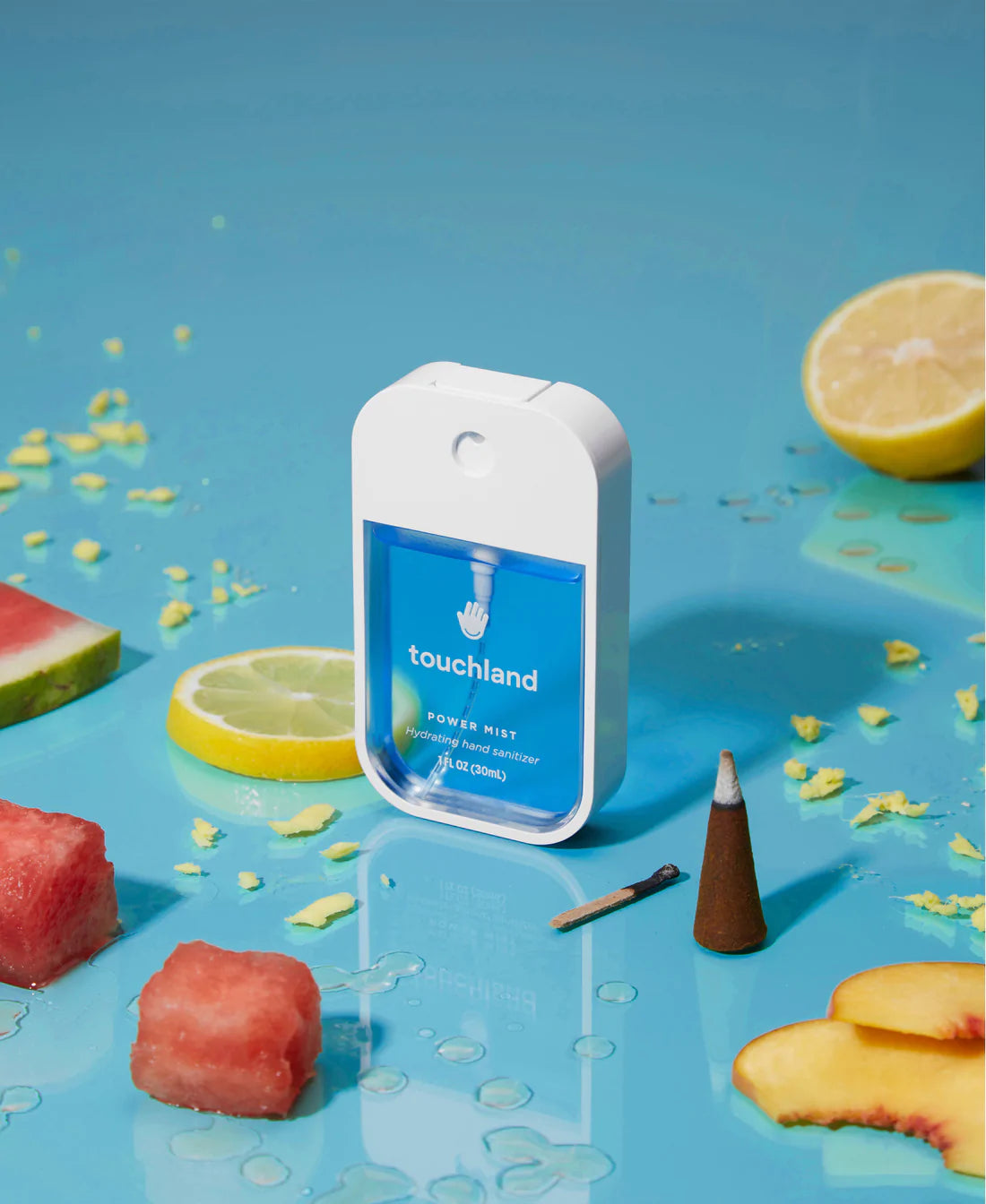 touchland hydrating hand sanitizer pouch with blue liquid center and rounded white case