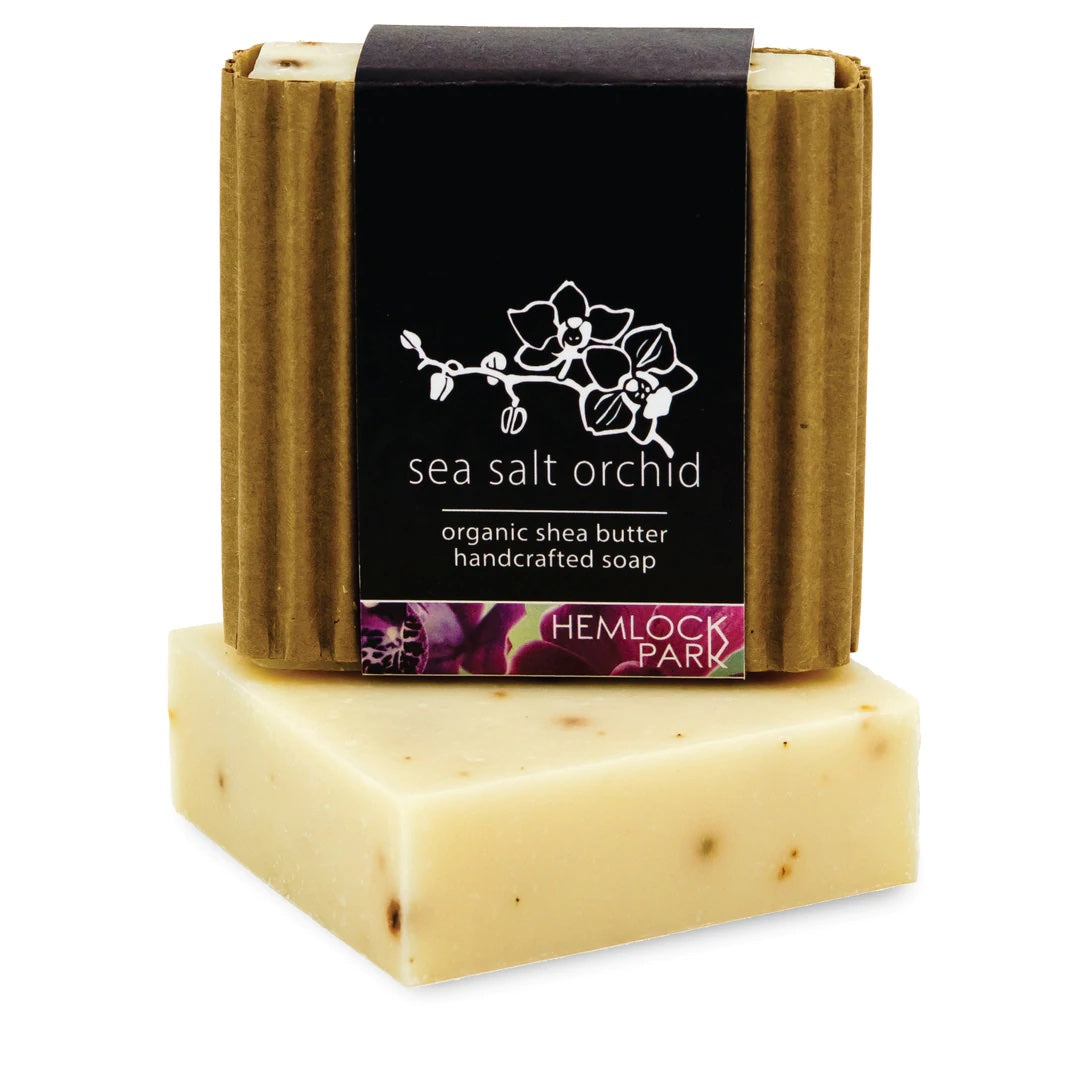 Sea salt orchid organic shea butter soap bar, pale cream color with dark label wrap