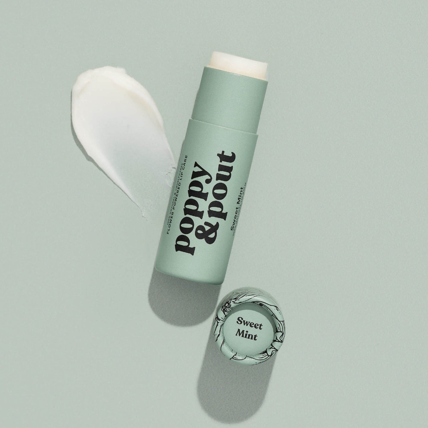 Mint lip balm tube with cap open and creamy balm shown