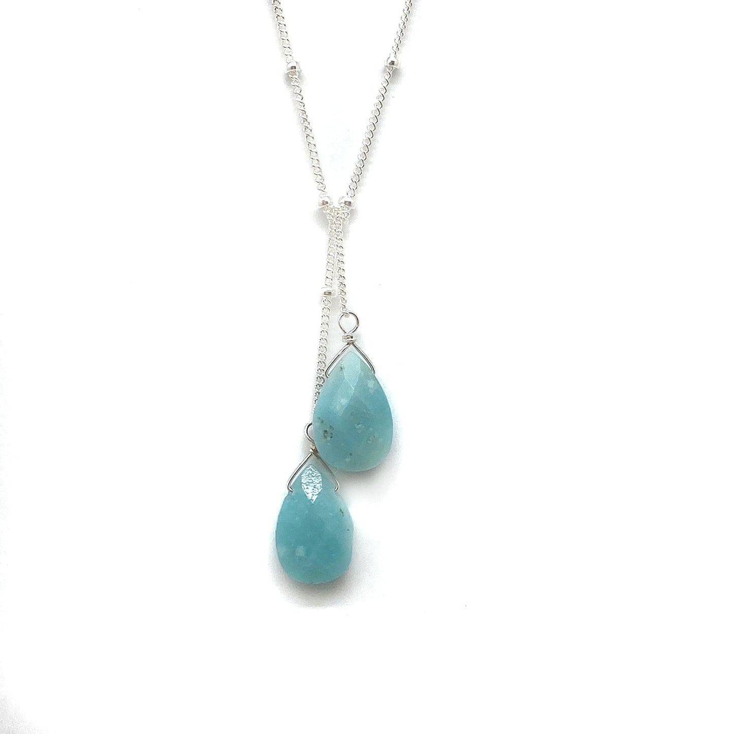 Sterling silver lariat necklace with two turquoise teardrop stones