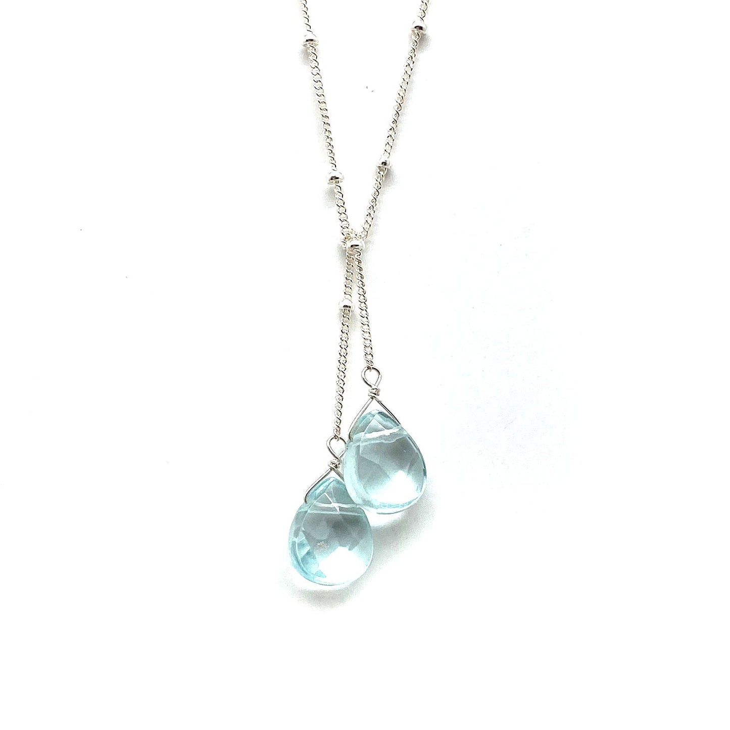 Sterling silver lariat necklace with two light blue teardrop stones