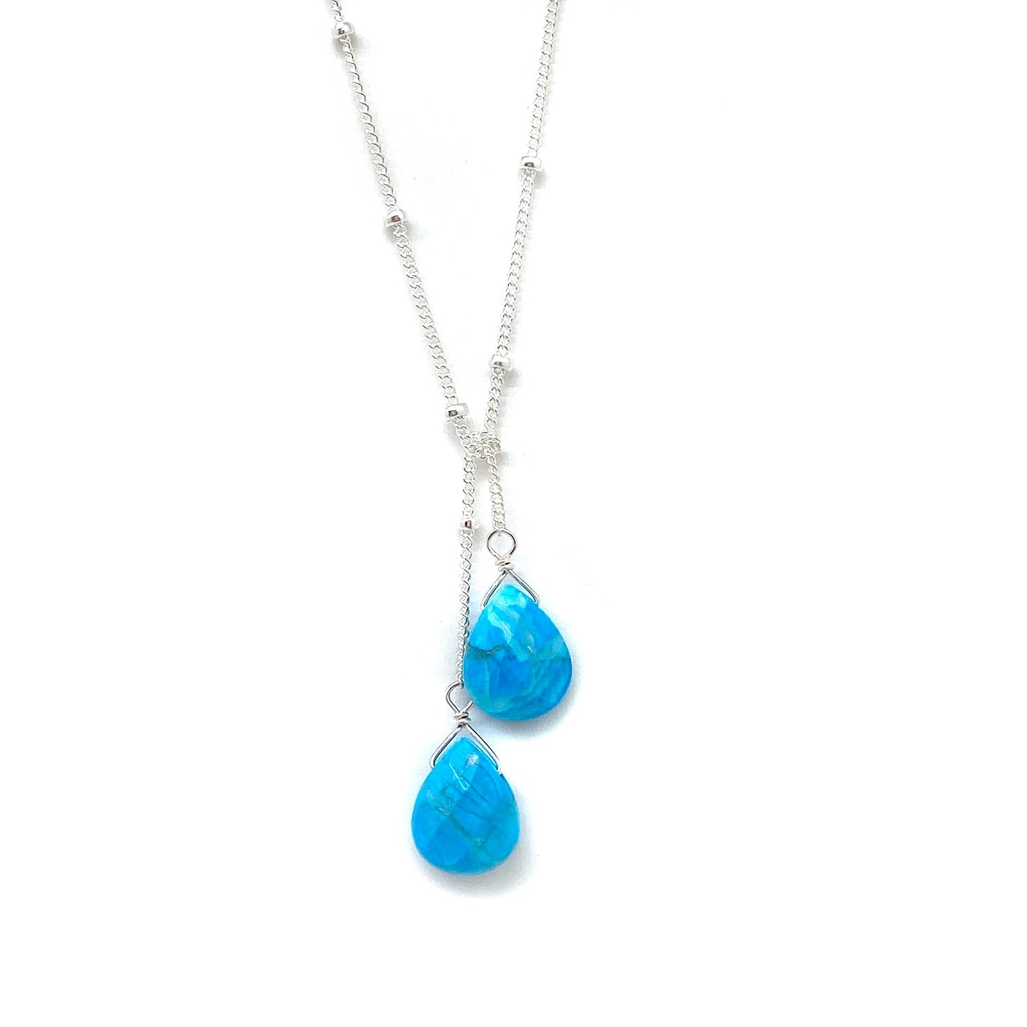 Sterling silver lariat necklace with two vivid blue teardrop stones