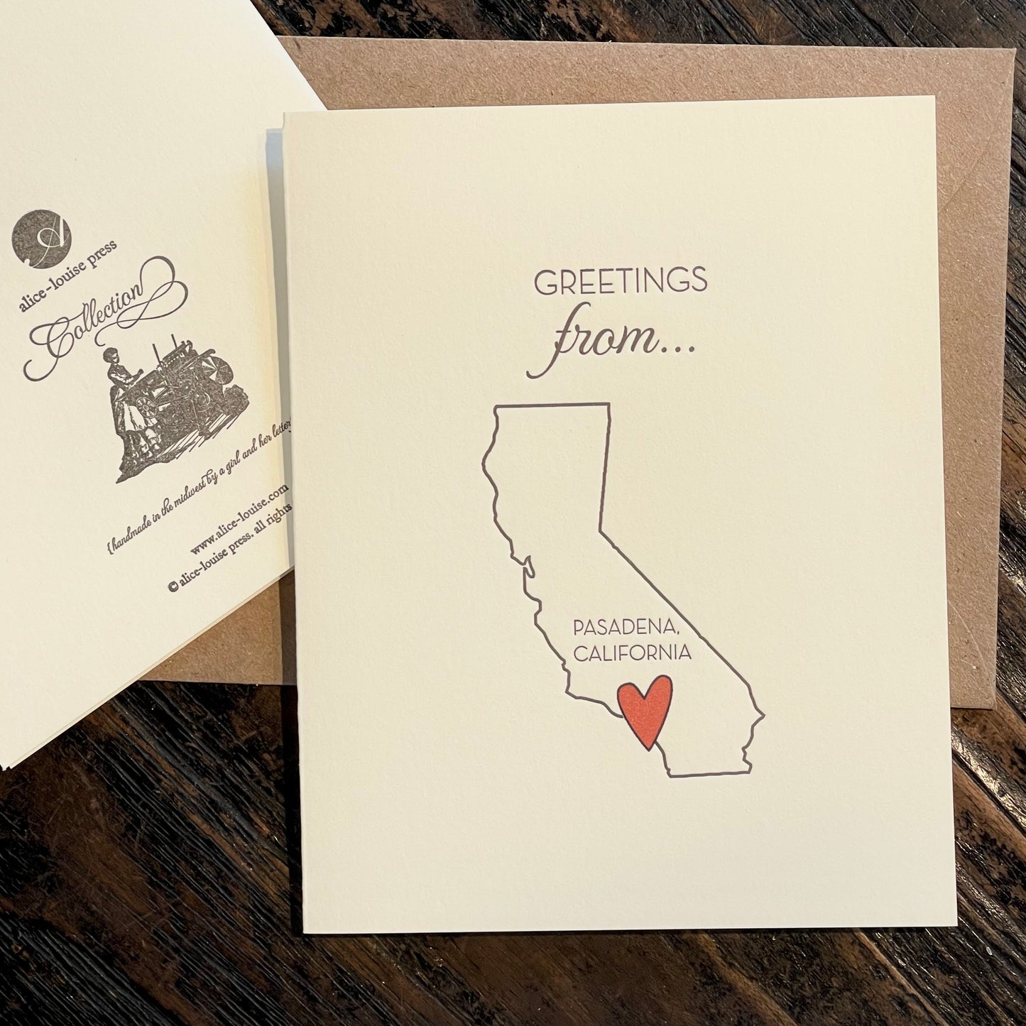 Greetings card with 'Greetings from...' text, Pasadena map outline and red heart