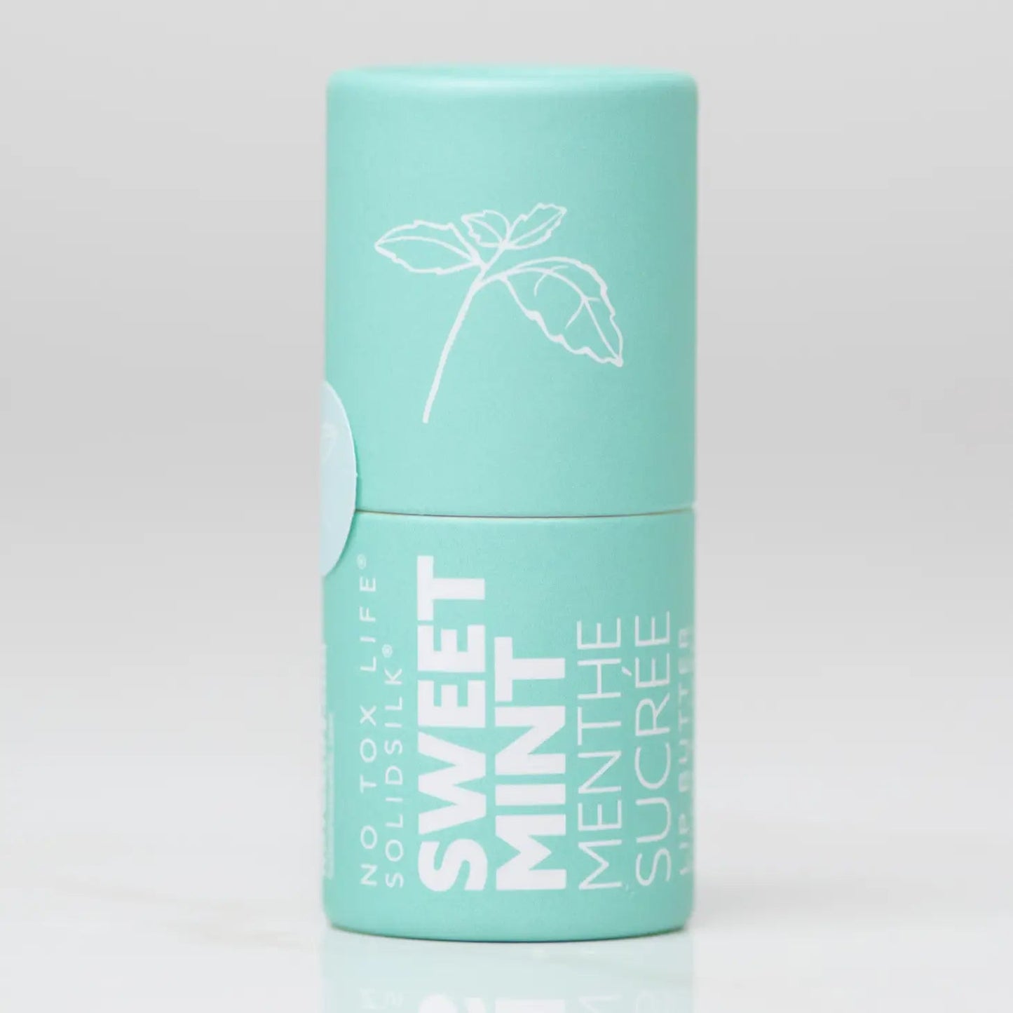 Mint teal lip butter tube with floral line illustration and vertical text