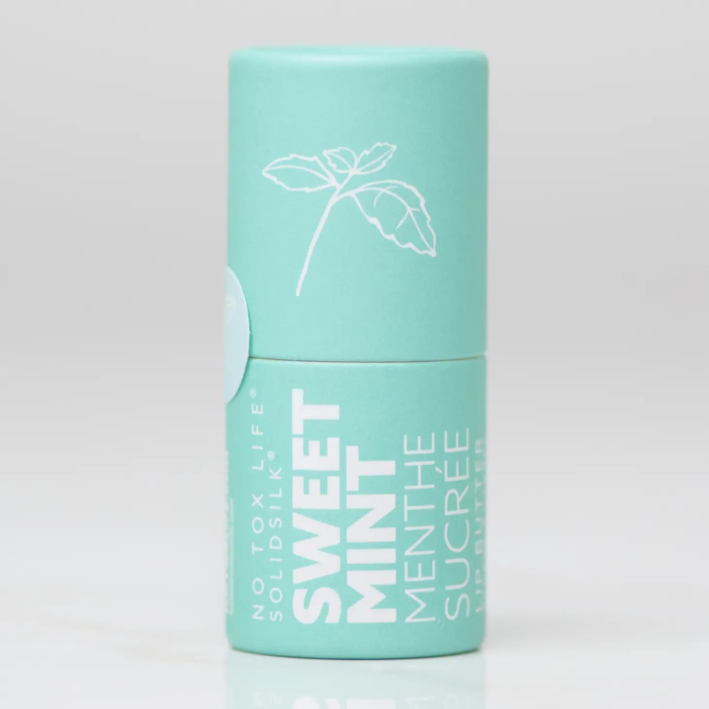 Mint teal lip butter tube with floral line illustration and vertical text