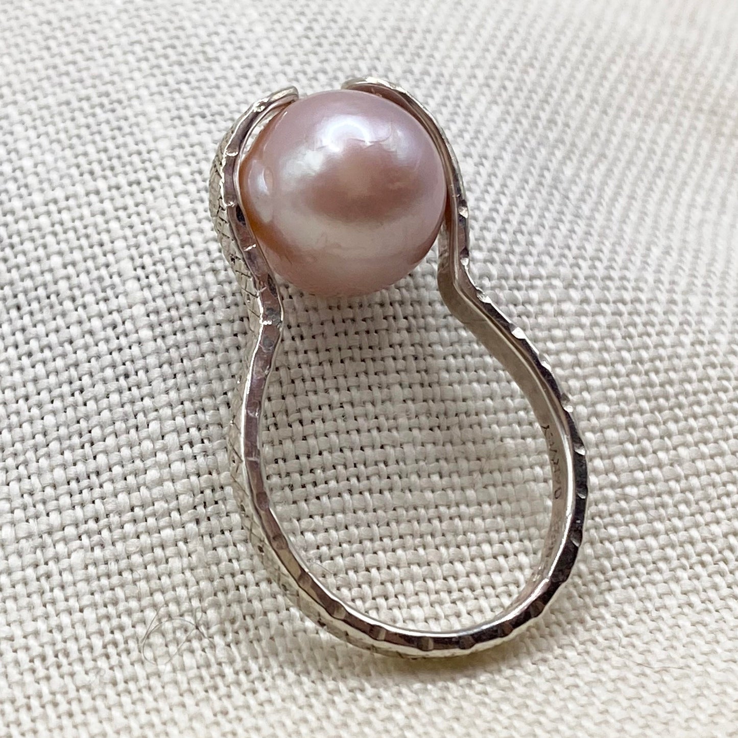 Sterling snake ring with blush pink pearl, top prong setting and curved band detail