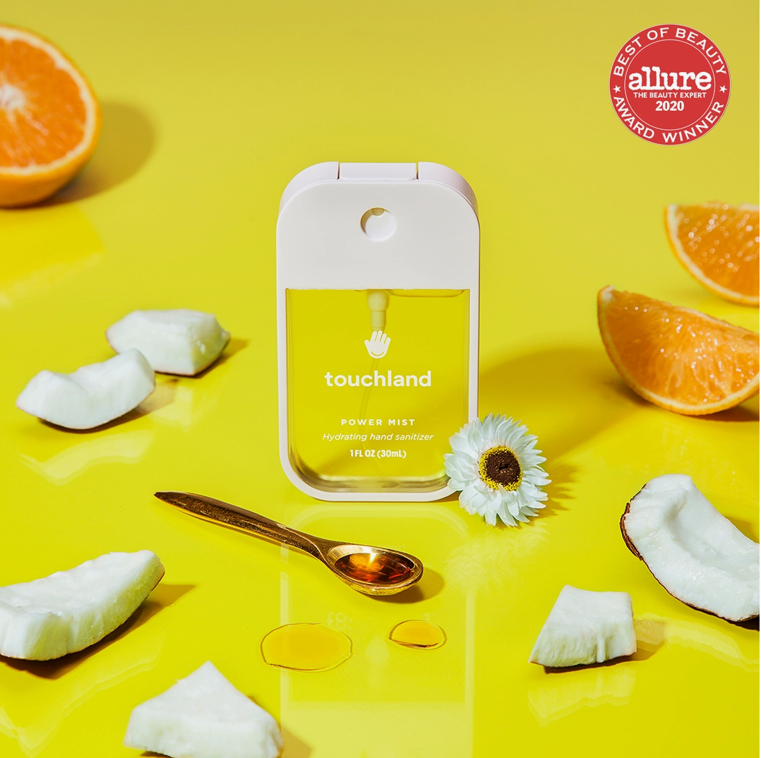 Hydrating hand sanitizer spray bottle with yellow label panel and front dispenser
