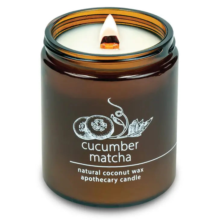 Coconut wax candle in amber jar with wood wick, cucumber matcha scent label