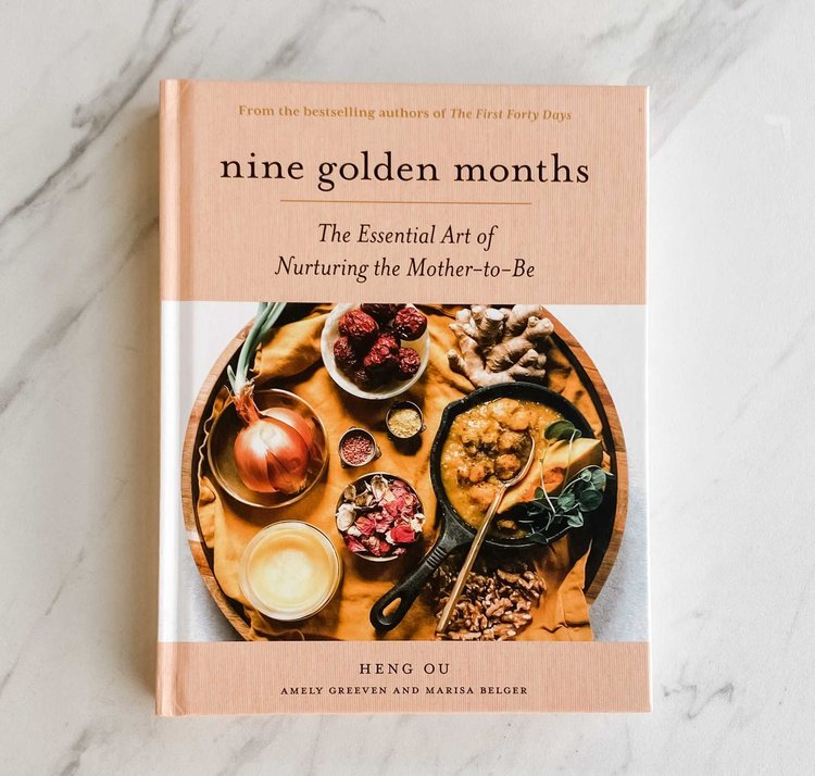 Nine Golden Months hardcover book with peach cover and circular food illustration
