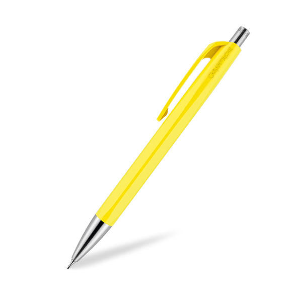 Yellow ballpoint pen with silver tip and clip