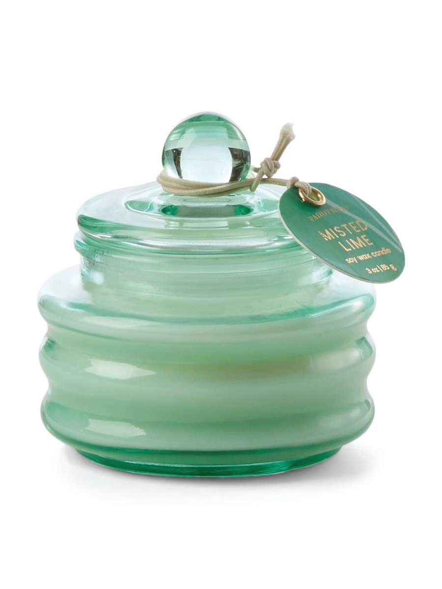 Misted lime-scent glass jar candle in light green with dome lid and round tag