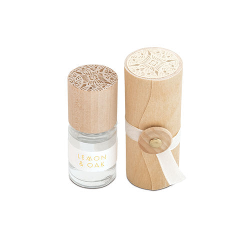 Lemon & oak rollerball perfume bottle with carved wooden cap and clear glass base