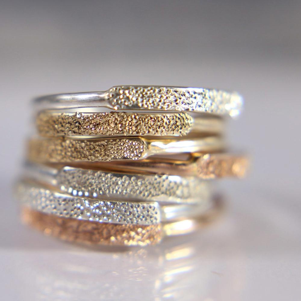 Sterling silver narrow ring with diamond-dust textured band, side sparkle